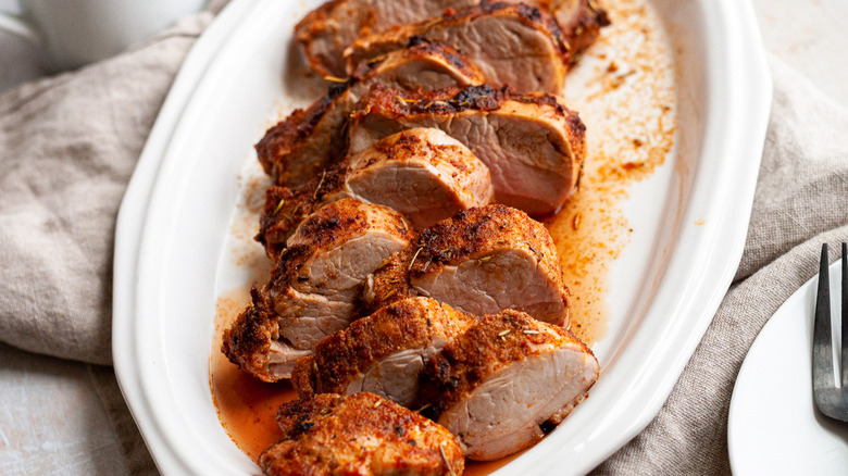 sliced pork tenderloin on plate