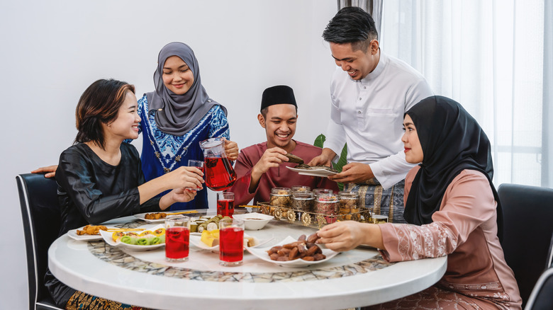 Guests being served Eid preparations.