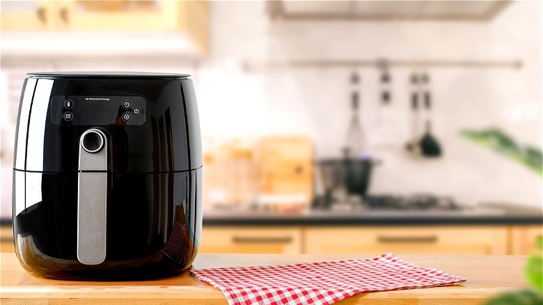Black air fryer on counter 