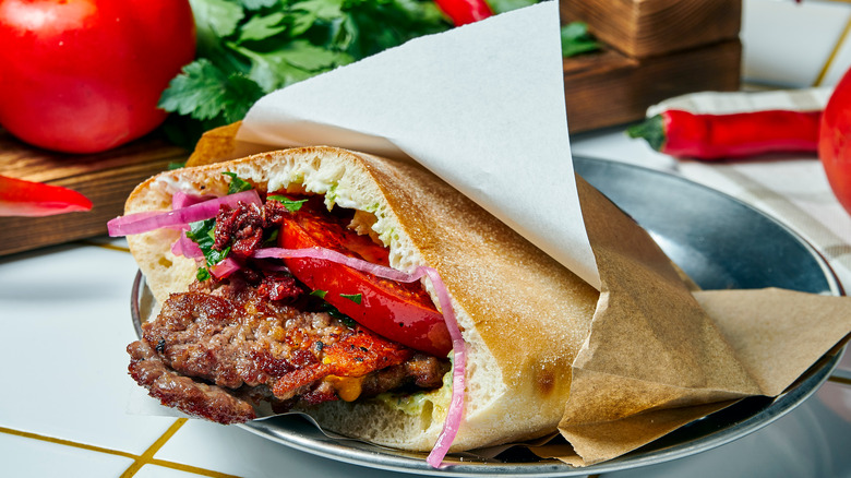 Burger and toppings in pita