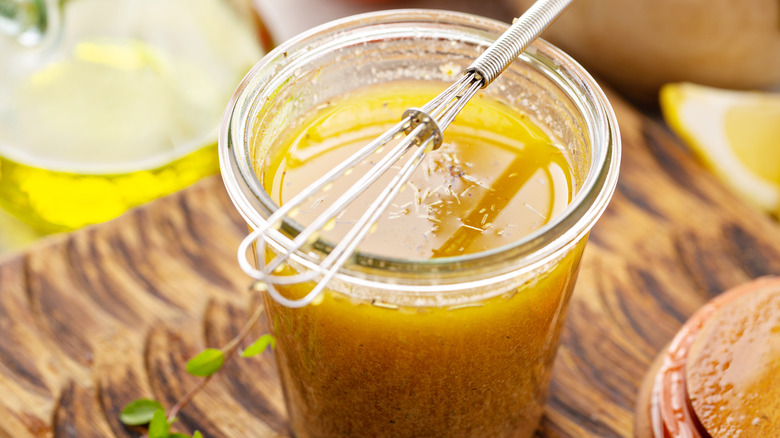 Homemade vinaigrette with whisk