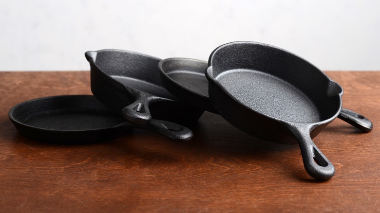 Several cast iron skillets