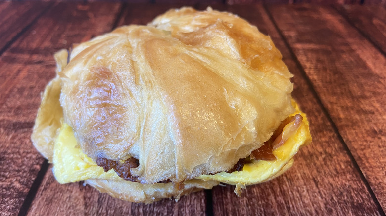 Sausge, bacon, egg, and cheese croissant breakfast sandwich