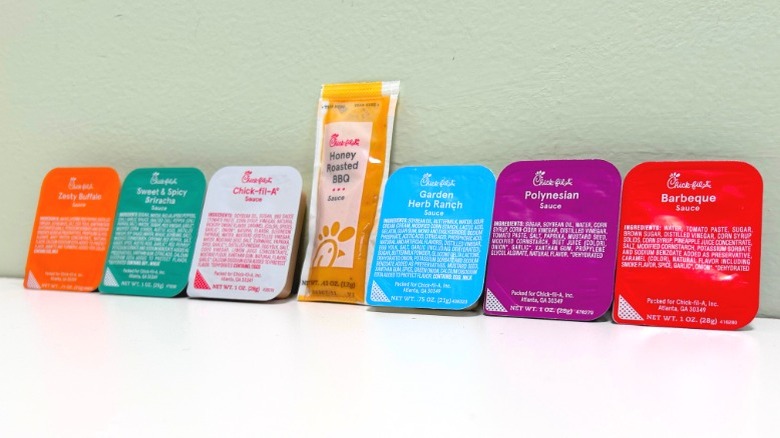 All seven Chick-fil-A Sauce packets lined up in a row