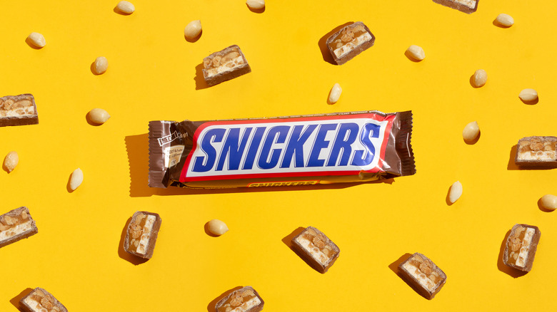 Snickers bar on yellow background