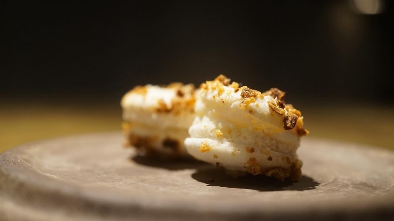 Two white puffs with a crunchy topping
