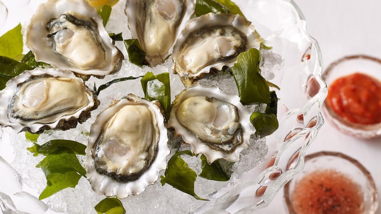 Raw oysters on ice in a crystal bowl