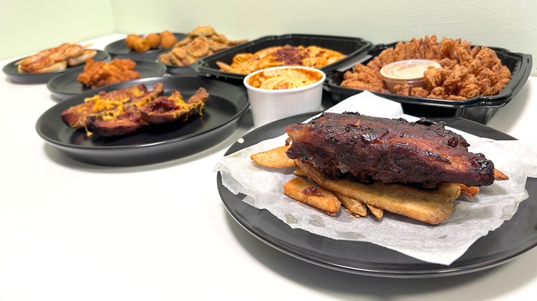 Several Texas Roadhouse appetizers arranged on a white counter