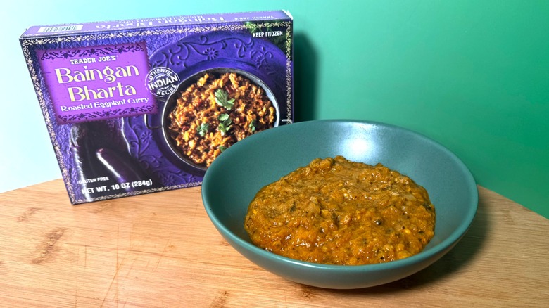 A bowl and box of Trader Joe's baingan bharta eggplant curry