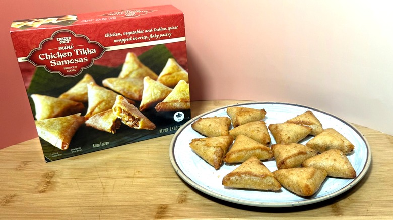A box and plate of Trader Joe's mini chicken samosas