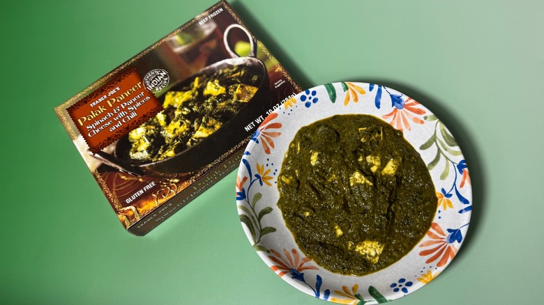 A bowl and box of Trader Joe's palak paneer