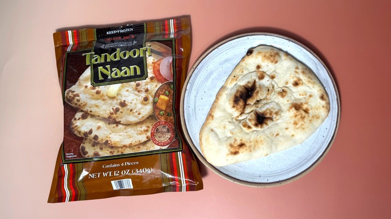 A bag of Trader Joe's naan and one piece of bread on plate