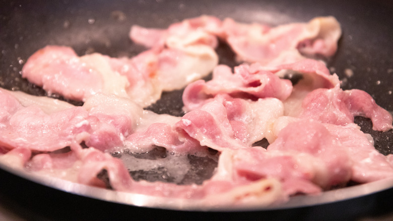bacon frying in pan