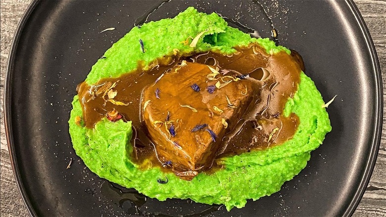 Stracotto Di Fassona Piemontese on black plate