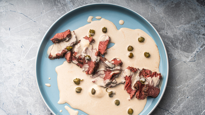 Vitello Tonnato on a blue plate