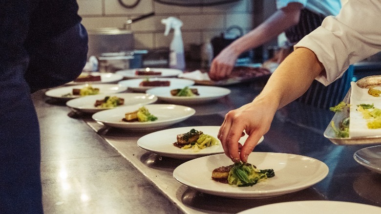 chefs plating dishes