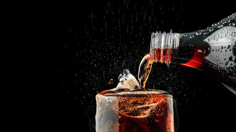 Cola beverage being poured into a glass