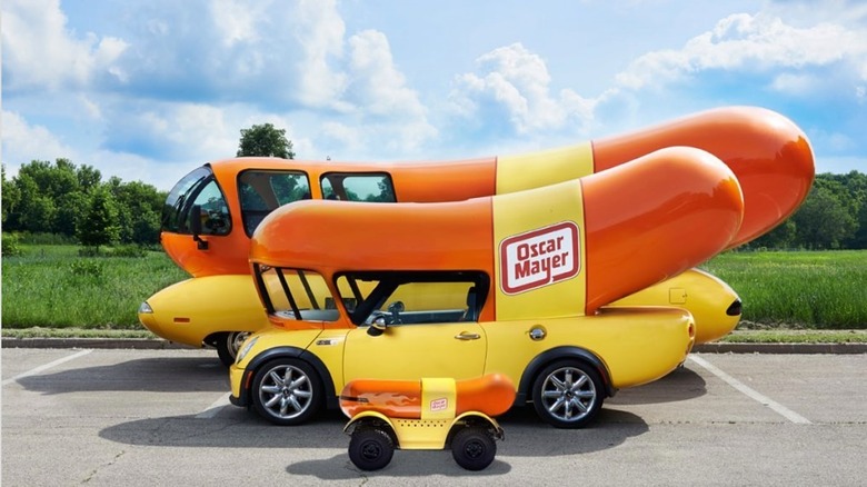 Wienermobile of three different sizes