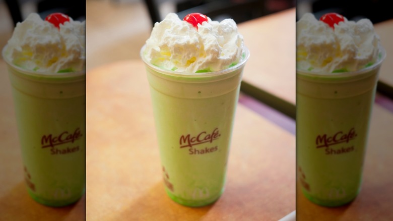McDonald's green Shamrock Shake with whipped cream and a cherry
