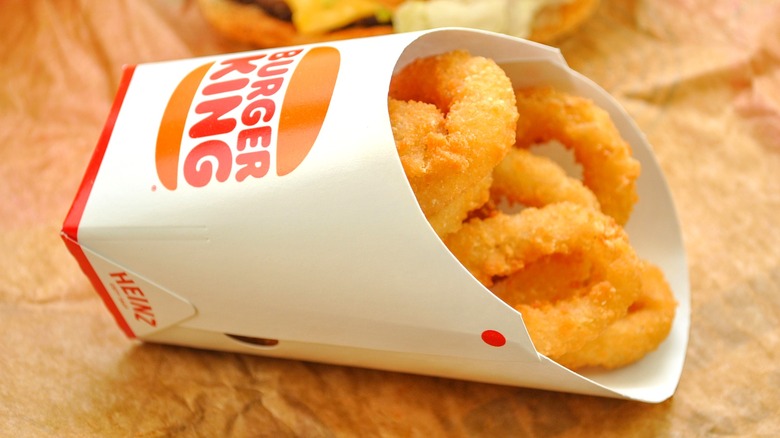 Close up of Burger King onion rings in carton on a table