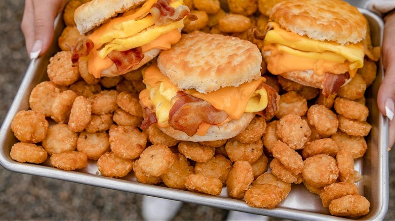 Tray full of Bacon Beast Biscuits and hash browns