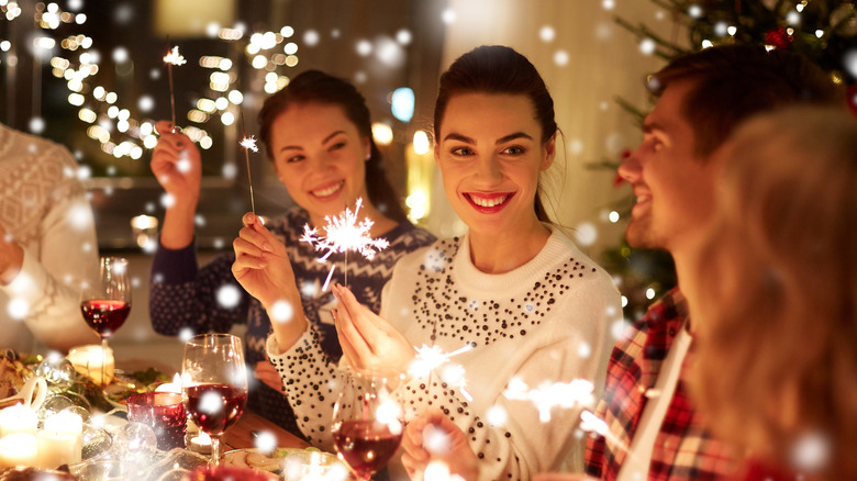 Christmas dinner party with sparklers