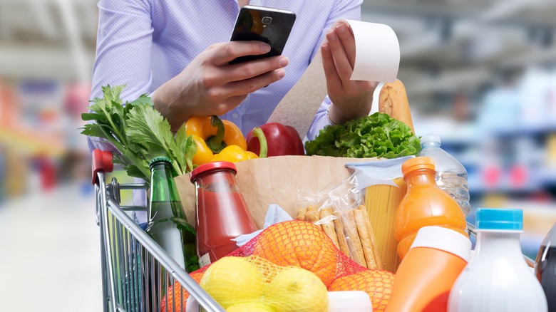 Person looking at grocery receipt