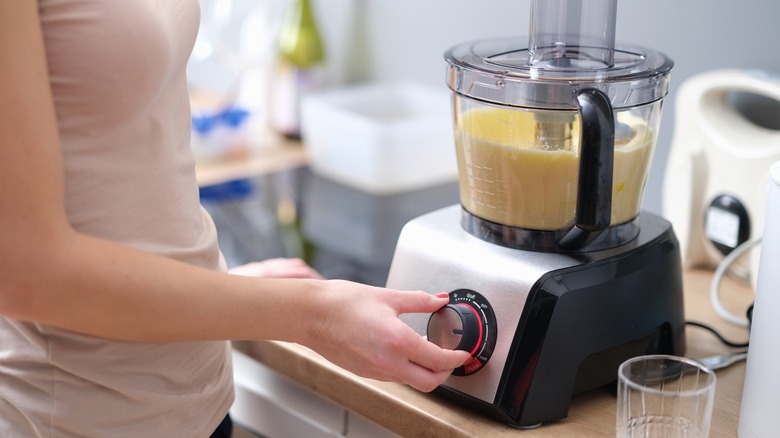woman using food processor