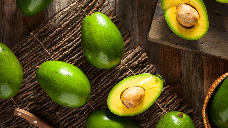 florida avocados on a rustic kitchen surface