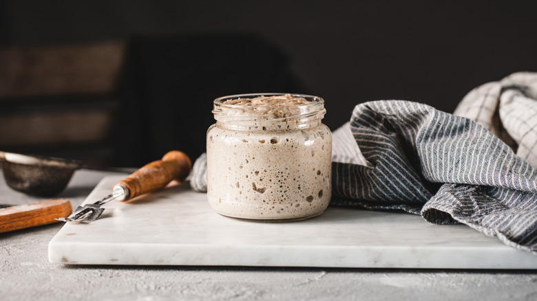 sourdough starter on a marble cutting board