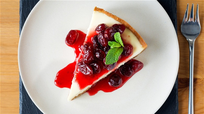 Cheesecake with red fruit sauce