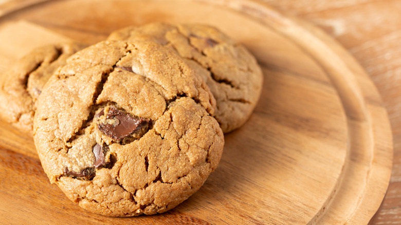 fluffy chocolate chip cookies on wood plate