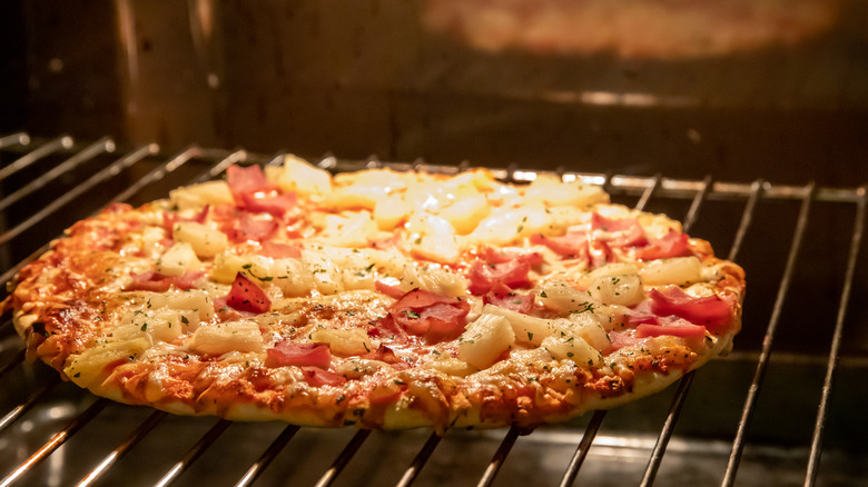 Frozen pizza in oven
