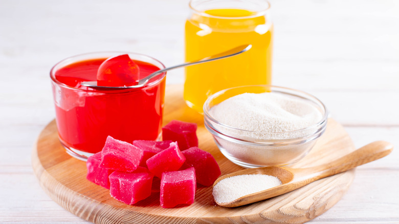 red and yellow jellies next to bowl of pectin