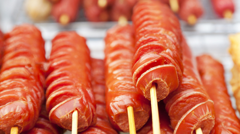 Spiral cut skewered hot dogs
