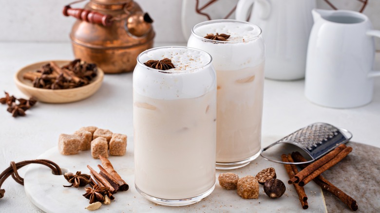 Two glass cups filled with iced chai tea