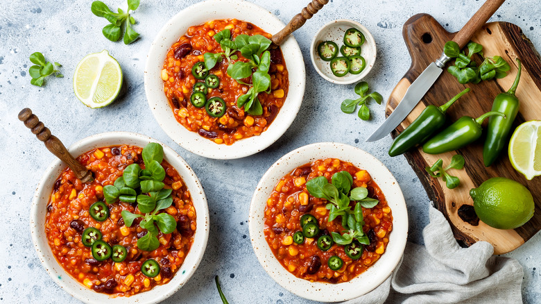 Bowls of chili with jalapeno