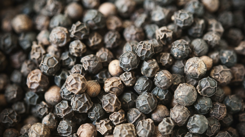 Whole black peppercorns