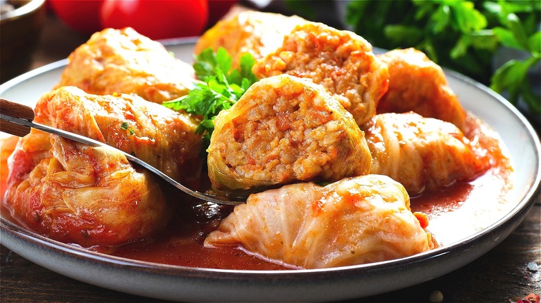 Stuffed cabbage rolls on gray plate 