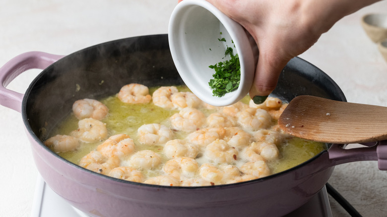 lemon juice and herbs in pan 