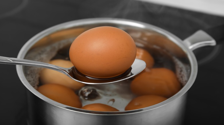 Eggs boiling in pot