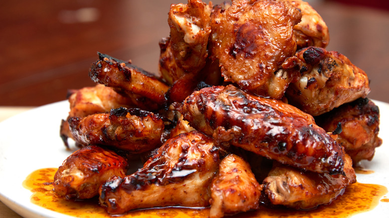 crispy charred chicken wings piled high