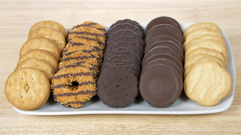 various flavors of Girl Scout cookies on a serving tray