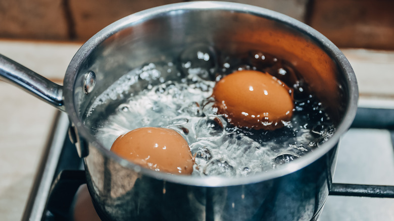 Eggs boiling in a pot