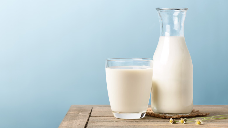 glass and pitcher of milk