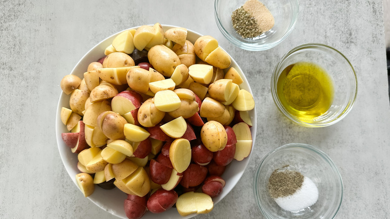 potatoes in bowl and seasoning