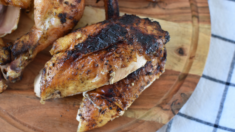 beer can chicken on wood tray