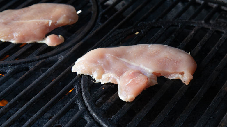 Raw chicken on grill
