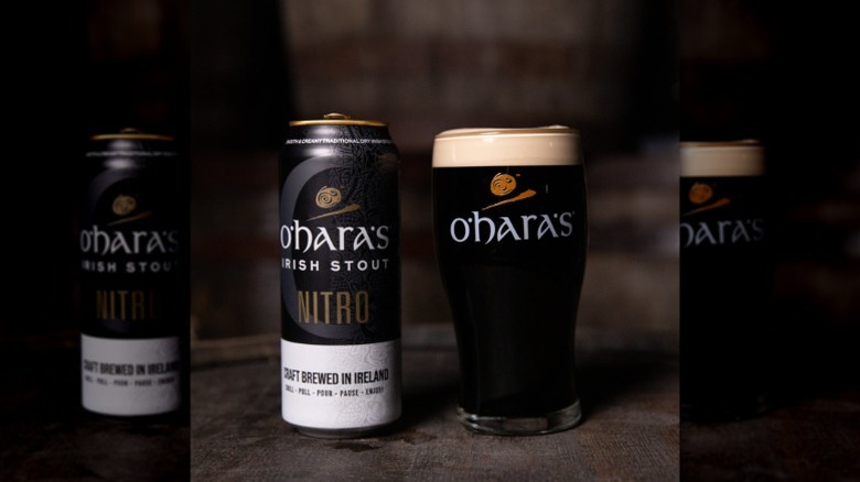 Glass and can of O'Hara's Irish Stout Nitro on a dark background