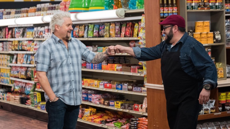 Guy Fieri fist bumping person